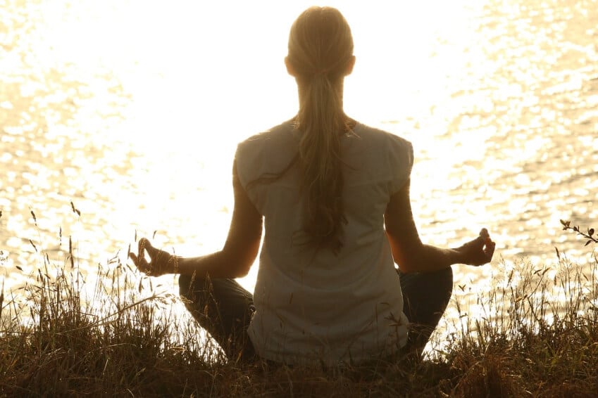 woman meditating outside